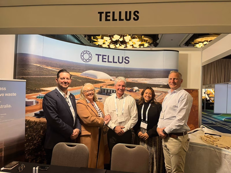 Tellus sales team stand in front of a Tellus banner set up for the 2025 Decommissioning and Abandonment Conference.